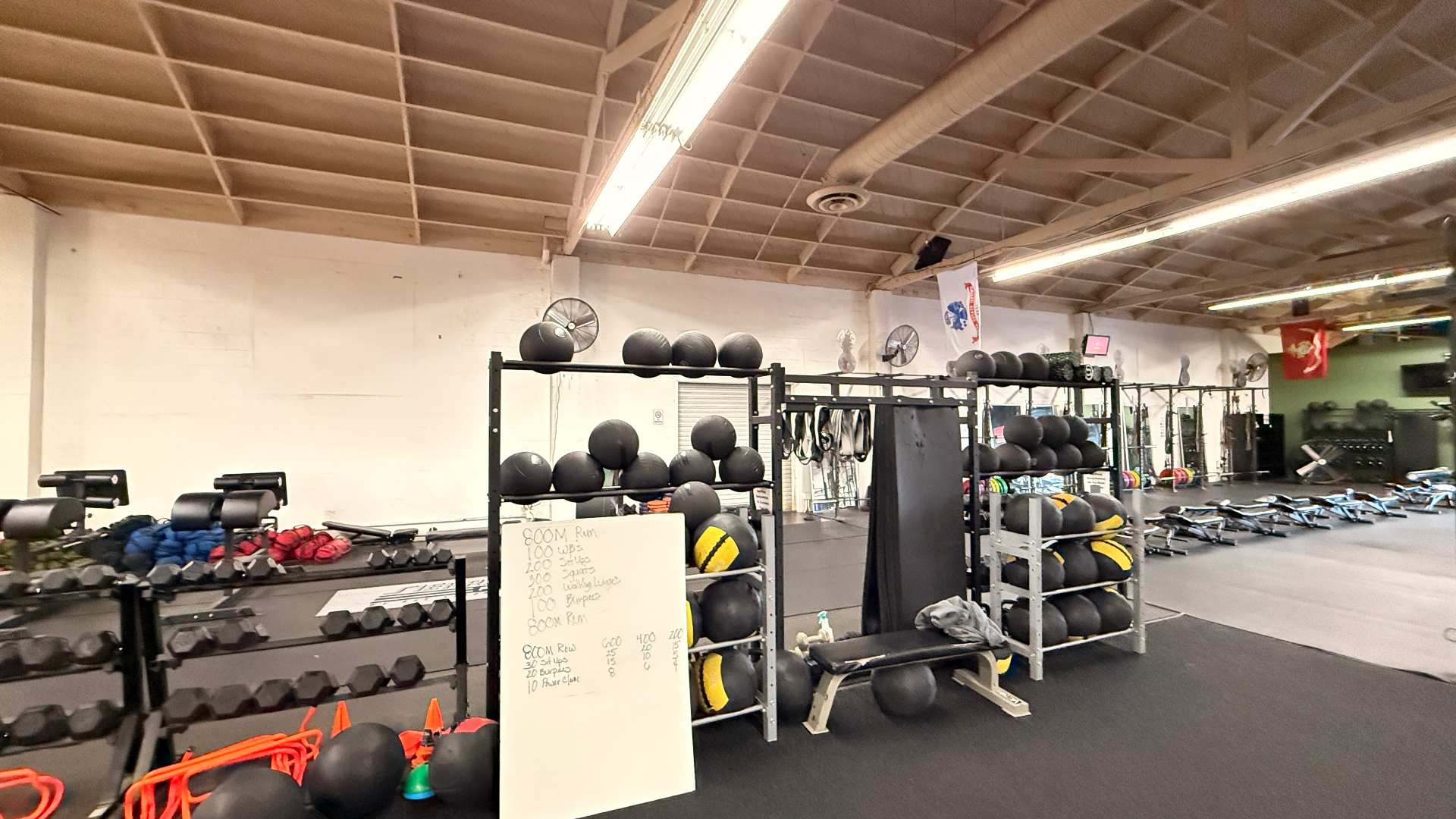 Sierra Tango Fitness training floor with med balls, dumbbells, and conditioning equipment